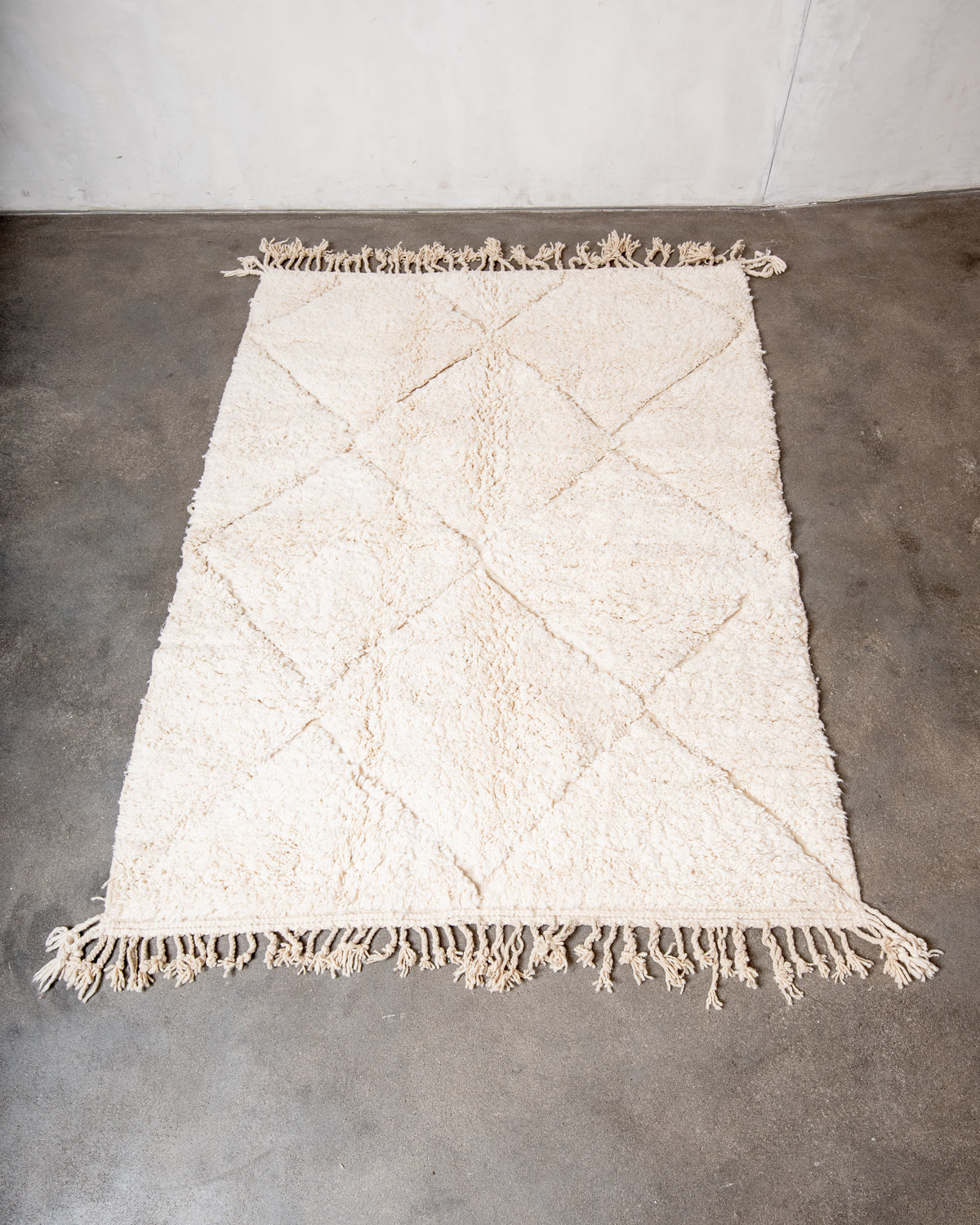 Modern, designer, handcrafted Berber rug from Morocco. Beniourain carpet with minimalist design, natural wool pile and a fluffy texture.